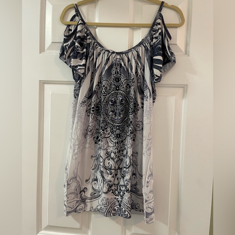 Cute shirt with rhinestones.  Size large.